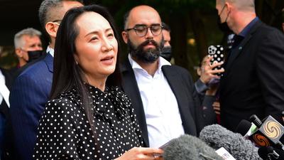 Huawei chief financial officer Meng Wanzhou (centre) talks to media at British Columbia Supreme Court after her extradition hearing ended in her favour, in Vancouver British Columbia, Canada on Friday. (AFP) Huawei chief financial officer Meng Wanzhou (centre) talks to media at British Columbia Supreme Court after her extradition hearing ended in her favour, in Vancouver British Columbia, Canada on Friday. (AFP)