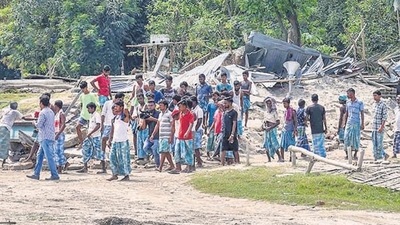 Villagers near their houses which were demolished during an eviction drive, at Gorukhuti in Darrang district, on Friday. (PTI) Villagers near their houses which were demolished during an eviction drive, at Gorukhuti in Darrang district, on Friday. (PTI)