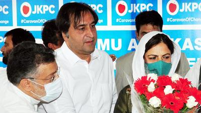 Jammu and Kashmir People's Conference president Sajjad Gani Lone appointed DDC Chairperson of Baramulla, Safina Baig as president of Peoples Conference Party’s Women’s wing, in Srinagar on Saturday. (Mohammad Amin War)