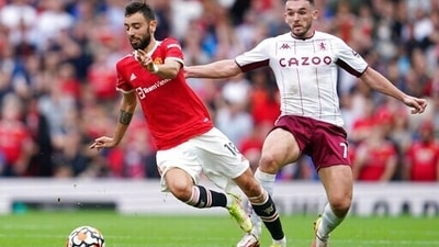 Manchester United's Bruno Fernandes, left, is challenged by Aston Villa's John McGinn during the English Premier League soccer match between Manchester United and Aston Villa at the Old Trafford stadium in Manchester, England, Saturday, Sept 25, 2021. (AP) Manchester United's Bruno Fernandes, left, is challenged by Aston Villa's John McGinn during the English Premier League soccer match between Manchester United and Aston Villa at the Old Trafford stadium in Manchester, England, Saturday, Sept 25, 2021. (AP)