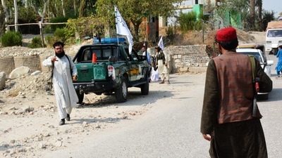 Taliban members inspect the site of a blast in Jalalabad. (AFP Photo) Taliban members inspect the site of a blast in Jalalabad. (AFP Photo)