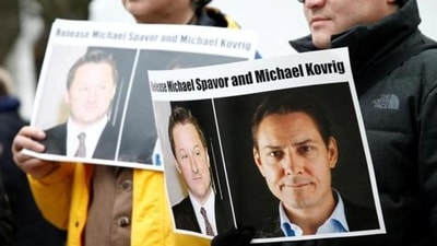 People hold signs calling for China to release Canadian detainees Michael Spavor and Michael Kovrig. (Reuters) People hold signs calling for China to release Canadian detainees Michael Spavor and Michael Kovrig. (Reuters)