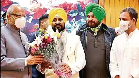 Punjab chief minister Charanjit Singh Channi (second from left) being felicitated by governor Banwarilal Purohit after he was sworn in at Raj Bhawan in Chandigarh on September 20 as Congress leaders Rahul Gandhi and Navjot Singh Sidhu look on, (HT file photo) Punjab chief minister Charanjit Singh Channi (second from left) being felicitated by governor Banwarilal Purohit after he was sworn in at Raj Bhawan in Chandigarh on September 20 as Congress leaders Rahul Gandhi and Navjot Singh Sidhu look on, (HT file photo)