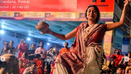 Dance: On the day of Dashami, married women gather in nearby pandals in the traditional red and white Bengali saree and smear red vermillion powder on Maa Durga and then on each other. They also perform traditional dance in front of Maa Durga's idol one last time before the visarjan.&nbsp;(Instagram/@antara.ka.mantra)