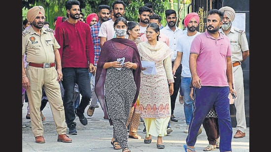 Candidates leaving the examination centre after appearing for the Punjab Police constable recruitment exam at Sacred Heart School in Ludhiana on Saturday. (Harsimar Pal Singh/HT)