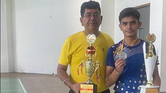 Lakshay of Sacred Heart School, Ludhiana, who has qualified for senior national badminton championship, is being coached by his father Mangat Rai Sharma. (HT Photo)