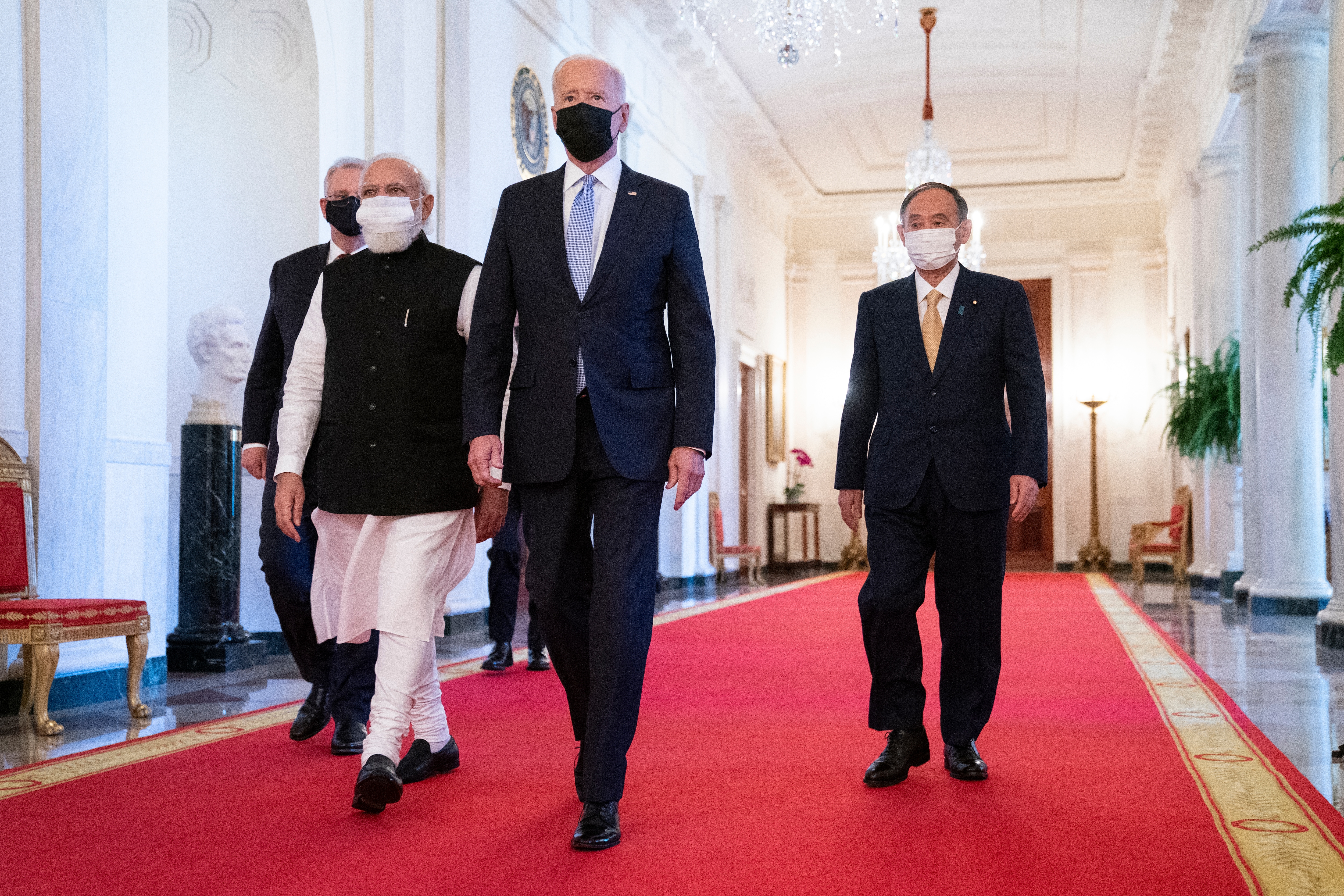 President Joe Biden walks to the Quad summit with from left, Australian Prime Minister Scott Morrison, Indian Prime Minister Narendra Modi, and Japanese Prime Minister Yoshihide Suga, in the East Room of the White House, Friday, Sept. 24, 2021, in Washington. (AP Photo/Evan Vucci) (AP) President Joe Biden walks to the Quad summit with from left, Australian Prime Minister Scott Morrison, Indian Prime Minister Narendra Modi, and Japanese Prime Minister Yoshihide Suga, in the East Room of the White House, Friday, Sept. 24, 2021, in Washington. (AP Photo/Evan Vucci) (AP)