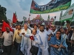 Samyukta Kisan Morcha activists take part in a torch rally ahead of their Bharat Bandh call on September 27 to protest against the three farm laws, in Jaipur, on Saturday.&nbsp;