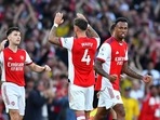 Arsenal's Kieran Tierney , Ben White and Gabriel celebrate after the match.