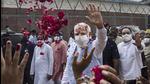 Prime Minister Narendra Modi greets supporters waiting at AFS Palam after arriving from his US visit, in New Delhi on Sunday. (PTI PHOTO.) Prime Minister Narendra Modi greets supporters waiting at AFS Palam after arriving from his US visit, in New Delhi on Sunday. (PTI PHOTO.)