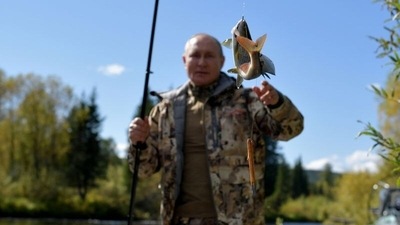 Russian President Vladimir Putin fishes during a short vacation at an unknown location in Siberia, Russia.&nbsp; (Kremlin via REUTERS)