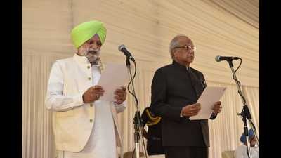 Congress MLA Rana Gurjit Singh taking oath as a minister in the presence of the Punjab governor. Congress MLA Rana Gurjit Singh taking oath as a minister in the presence of the Punjab governor.