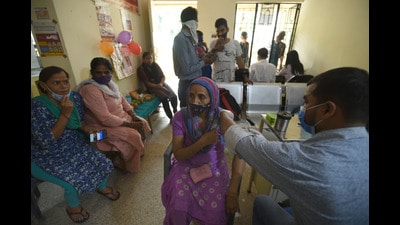 A health worker administers a dose of Covid-19 vaccine, at a primary health centre in Noida Sector 22 on Saturday. (Sunil Ghosh/HT Photo) A health worker administers a dose of Covid-19 vaccine, at a primary health centre in Noida Sector 22 on Saturday. (Sunil Ghosh/HT Photo)