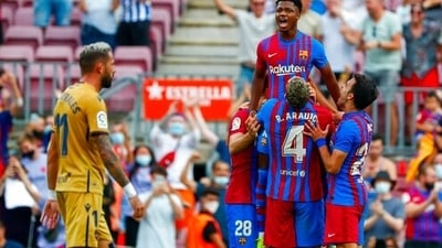 Barcelona's Ansu Fati celebrates after scoring his side's third goal during a Spanish La Liga soccer match between FC Barcelona and Levante at the Camp Nou stadium in Barcelona, Spain, Sunday, Sept. 26, 2021. (AP Photo/Joan Monfort) (AP)