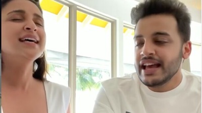 Parineeti Chopra singing a song with her brother Shivang. Parineeti Chopra singing a song with her brother Shivang.