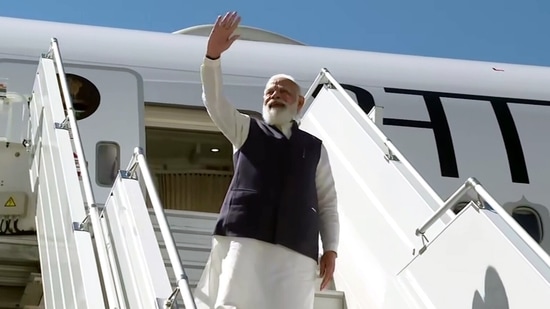 Prime Minister Narendra Modi waves as he emplanes for India after concluding his US visit,&nbsp;(ANI Photo)