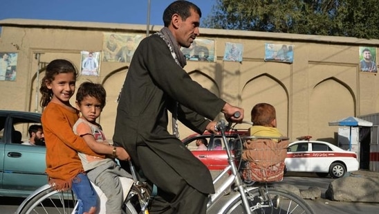 A man along with children rides a bicycle in Kabul (AFP/Image used only for representative purpose)