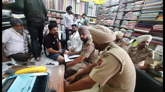 Punjab Police recording statement of forex trader in Amritsar on Sunday. (HT)
