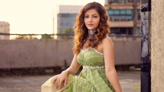 The dress was cinched at the waist with a matching fabric belt decorated with floral threadwork. Rubina completed her look with strappy pumps and a bohemian choker necklace with chain embellishments.(Instagram/@rubinadilaik)