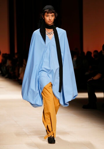A model wears a creation as part of the Salvatore Ferragamo women's and men's Spring Summer 2022 collection(AP) A model wears a creation as part of the Salvatore Ferragamo women's and men's Spring Summer 2022 collection(AP)