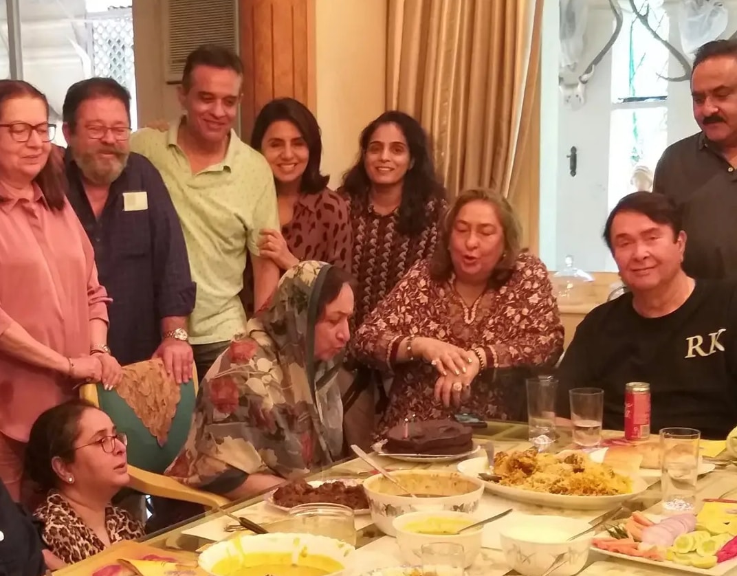 Neila Kapoor blowing out candles on a cake.