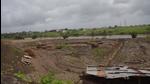 A construction on the blue floodline of a river in Pune. Civic activists seek inquiry into permissions given for buildings on the blue floodline and act against officers. (HT FILE) A construction on the blue floodline of a river in Pune. Civic activists seek inquiry into permissions given for buildings on the blue floodline and act against officers. (HT FILE)