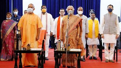 The BJP leaders, who were inducted into the council of ministers, with chief minister Yogi Adityanath and governor Anandiben Patel at the swearing-in ceremony. (ANI Photo)