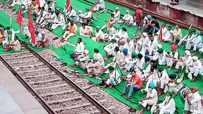 Farmers lay siege to a rail line at Bahadurgarh railway station during a 10-hour bandh on Monday. (Manoj Dhaka/HT) Farmers lay siege to a rail line at Bahadurgarh railway station during a 10-hour bandh on Monday. (Manoj Dhaka/HT)