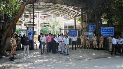 Lawyers and security personnel outside the Rohini court in Delhi, the day after Gogi was shot dead inside a courtroom. (Sanchit Khanna/HT Photo)
