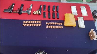 The ammo, drugs and fake currency recovered by BSF in Jammu on Monday. (HT Photo)