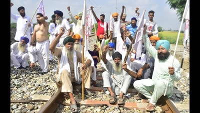 Farmers block the railway tracks during a protest in Amritsar as part of the Bharat bandh call given by the Samyukt Kisan Morcha against the Centre’s three farm laws.