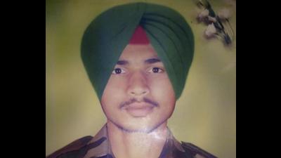 Kurukshetra jawan Gurjant Singh who was consigned to flames at his native village on Monday. (HT PHOTO)