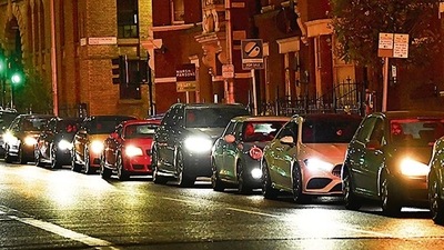 Cars queue to refill at a fuel station in south London on Sunday. REUTERS