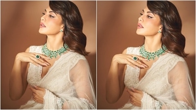 Flaunting her midriff, Jacqueline teamed the saree with a sleeveless bralette-styled blouse. The blouse had a plunging neckline, lace adorned hem, bead and pearl embroidery, and intricate threadwork.&nbsp; (Instagram/@chandiniw)