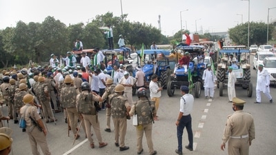 Security personnel stand guard at Noida as Bharatiya Kisan Union (BKU) members participate in farmers' 'Bharat Bandh' against the Centre's three farm reform laws, (PTI Photo) (PTI) Security personnel stand guard at Noida as Bharatiya Kisan Union (BKU) members participate in farmers' 'Bharat Bandh' against the Centre's three farm reform laws, (PTI Photo) (PTI)