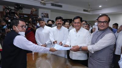 Sarbananda Sonowal (second from right) with Assam Chief Minister Himanta Biswa Sarma (first from right) accepting the winner’s certificate for his election to Rajya Sabha on Monday. (Himanta Biswa Sarma/Twitter) Sarbananda Sonowal (second from right) with Assam Chief Minister Himanta Biswa Sarma (first from right) accepting the winner’s certificate for his election to Rajya Sabha on Monday. (Himanta Biswa Sarma/Twitter)