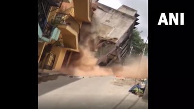 A video circulated on social media showed the dramatic collapse of the three-storey building. (Screengrab from ANI video) A video circulated on social media showed the dramatic collapse of the three-storey building. (Screengrab from ANI video)