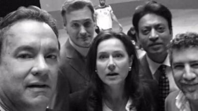 Irrfan Khan poses for a selfie with Tom Hanks. Irrfan Khan poses for a selfie with Tom Hanks.