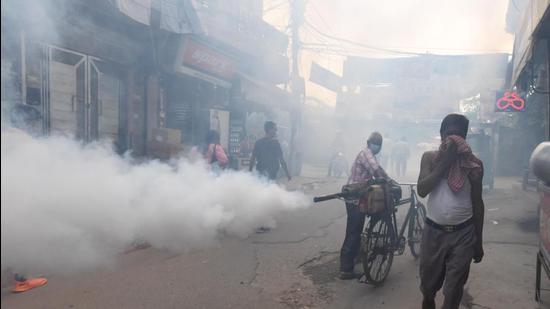 An east corporation worker in Delhi worker fumigates Ganesh Nagar area. An official of the corporation said, “Nowadays, we see cases being reported well into November. Earlier, the number of cases used to go down mid-October, as temperatures started dropping.” (Raj K Raj/HT Photo) An east corporation worker in Delhi worker fumigates Ganesh Nagar area. An official of the corporation said, “Nowadays, we see cases being reported well into November. Earlier, the number of cases used to go down mid-October, as temperatures started dropping.” (Raj K Raj/HT Photo)