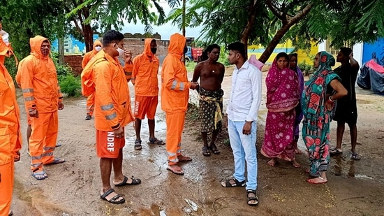 National Disaster Response Force (NDRF) personnel interact with local residents in the wake of Cyclone Gulab, in Ganjam. (ANI Photo) National Disaster Response Force (NDRF) personnel interact with local residents in the wake of Cyclone Gulab, in Ganjam. (ANI Photo)