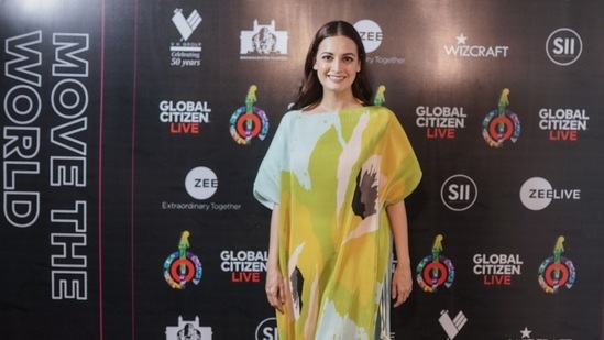 Dia Mirza in a colourful kaftan, posing at the red carpet.