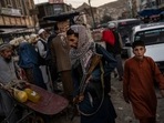 Taliban fighters patrol a market in Kabul's Old City. Taliban fighters patrol a market in Kabul's Old City.
