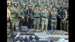 Indian Army personnel displaying arms and ammunitions recovered from three militants killed in Uri area of Baramulla district on September 23. (PTI Photo) Indian Army personnel displaying arms and ammunitions recovered from three militants killed in Uri area of Baramulla district on September 23. (PTI Photo)