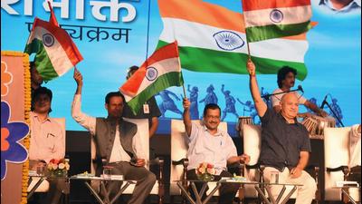 Delhi chief minister Arvind Kejriwal, deputy chief minister Manish Sisodia and principal secretary (education) H Rajesh Prasad wave the Tricolour during the launch of Deshbhakti curriculum in Delhi government schools.