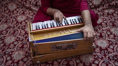 An Afghan musician plays the harmonium in Kabul, on September 16. “The current situation is oppressive,” Muzafar Bakhsh, a 21-year-old who played in a wedding band told AP. His family had just sold off part of its belongings at Kabul’s new flea market, Chaman-e-Hozari. “We keep selling them … so we don’t die of starvation,” said Bakhsh, whose late grandfather was Ustad Rahim Bakhsh, a famous maestro of Afghan classical music. (Bernat Armangue / AP) An Afghan musician plays the harmonium in Kabul, on September 16. “The current situation is oppressive,” Muzafar Bakhsh, a 21-year-old who played in a wedding band told AP. His family had just sold off part of its belongings at Kabul’s new flea market, Chaman-e-Hozari. “We keep selling them … so we don’t die of starvation,” said Bakhsh, whose late grandfather was Ustad Rahim Bakhsh, a famous maestro of Afghan classical music. (Bernat Armangue / AP)