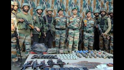 Indian Army personnel displaying arms and ammunitions recovered from three militants killed in Uri area of Baramulla district on September 23. (PTI Photo) Indian Army personnel displaying arms and ammunitions recovered from three militants killed in Uri area of Baramulla district on September 23. (PTI Photo)