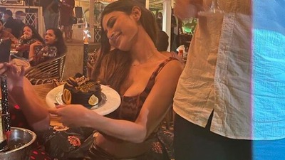 Mouni Roy is like a kid in a candy store as she holds on to her birthday cake tight. (Instagram/@imouniroy)