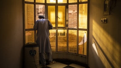 An Afghan singer looks out a window in Kabul, on September 14. At the Afghanistan National Institute of Music, most of the classrooms are empty. None of the teachers nor the 350 students have come back since the takeover. The institute was once famous for its inclusiveness and emerged as the face of a new Afghanistan. Now, it is guarded by fighters from the Haqqani network, an ally of the Taliban considered a terrorist group by the United States. (Bernat Armangue / AP) An Afghan singer looks out a window in Kabul, on September 14. At the Afghanistan National Institute of Music, most of the classrooms are empty. None of the teachers nor the 350 students have come back since the takeover. The institute was once famous for its inclusiveness and emerged as the face of a new Afghanistan. Now, it is guarded by fighters from the Haqqani network, an ally of the Taliban considered a terrorist group by the United States. (Bernat Armangue / AP)