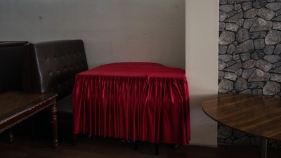 A grand piano is covered in a red cloth inside a hookah bar in Kabul, on September 21. In the family home of another ustad in Kharabat, everyone’s bags are packed, ready to leave when they can. In one room, a group of musicians was gathered on a recent day, drinking tea and discussing the situation. They shared photos and videos from their performances around the world — Moscow, Baku, New Delhi, Dubai, New York. (Bernat Armangue / AP) A grand piano is covered in a red cloth inside a hookah bar in Kabul, on September 21. In the family home of another ustad in Kharabat, everyone’s bags are packed, ready to leave when they can. In one room, a group of musicians was gathered on a recent day, drinking tea and discussing the situation. They shared photos and videos from their performances around the world — Moscow, Baku, New Delhi, Dubai, New York. (Bernat Armangue / AP)
