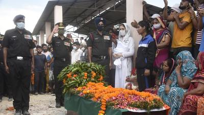 The family of Indian Army’s Lance Naik Amrish Tyagi cremated his body on Tuesday at his village Hisali in Ghaziabad’s Muradnagar. (Sakib Ali/HT) The family of Indian Army’s Lance Naik Amrish Tyagi cremated his body on Tuesday at his village Hisali in Ghaziabad’s Muradnagar. (Sakib Ali/HT)